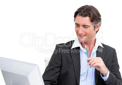 Charming businessman working at a computer