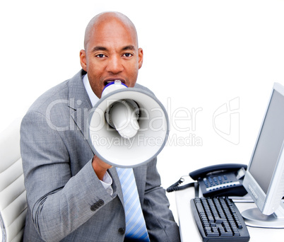 Angry businessman yelling through a megaphone