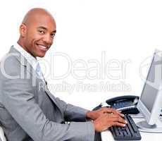 Handsome businessman working at a computer