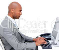 Serious businessman working at a computer