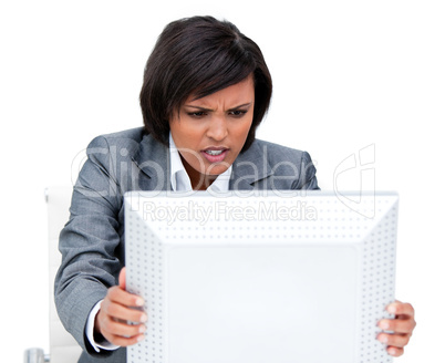 Frustrated businesswoman shaking her computer's screen