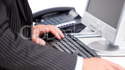 Close-up of a businessman working at a computer