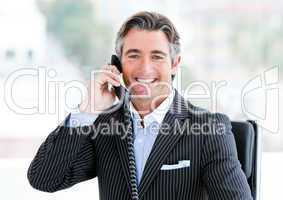 Self-assured mature businessman talking on phone