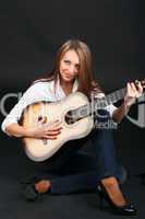 Woman with guitar.