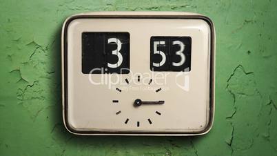 Clock on a green wall