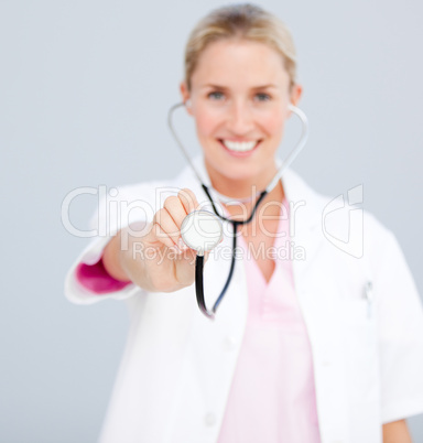 Smiling female doctor  pointing at the camera