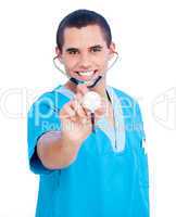 Hispanic male doctor wearing blue uniform holding a stethoscope
