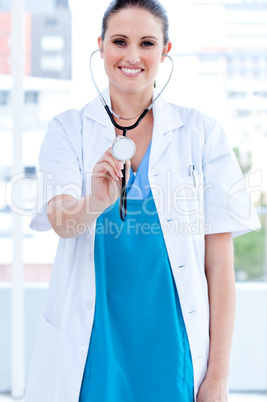 Caucasian female doctor holding a stethoscope
