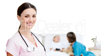 Portrait of smiling female doctor located in a patient room