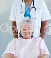 Smiling senior patient sitting on a wheelchair