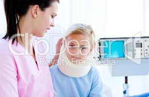 Sad little girl with a neck brace sitting with her nurse