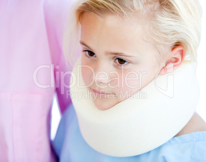 Close-up of a little girl with a neck brace