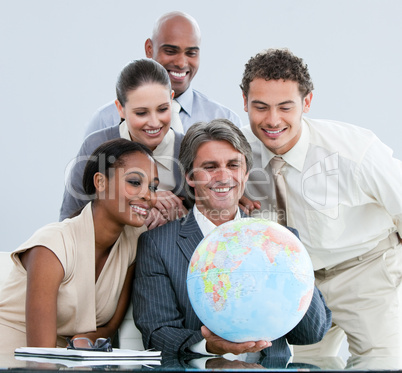 United businessteam holding a globe  globalization concept