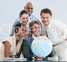 United businessteam holding a globe  globalization concept