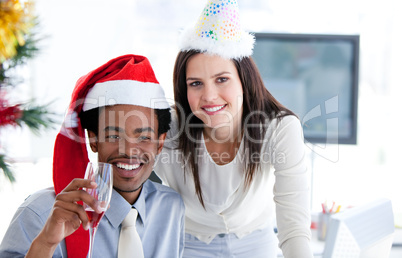 Business partners drinking to celebrates christmas