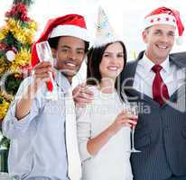 United business team drinking champagne to celebrate christmas