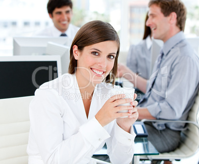 Smiling businesswoman holding a cup of tea