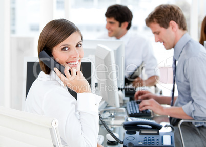 Smiling businesswoman talking to the phone
