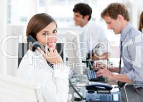 Smiling businesswoman talking to the phone
