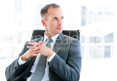 Confident  businessman thinking about the company