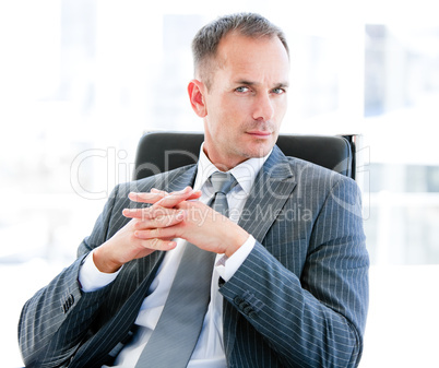 Self-assured businessman looking at the camera