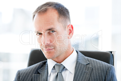 Attractive businessman looking at the camera