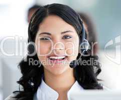 Beautiful businesswoman wearing a headset to talk with customer