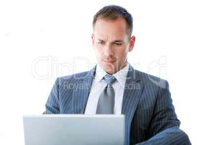 Handsome businessman using his laptop