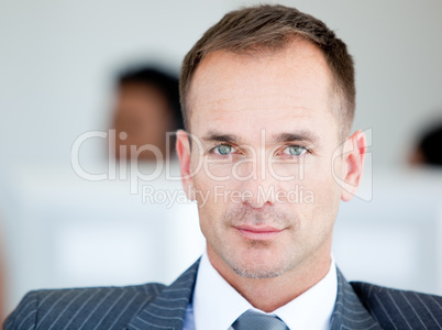 Handsome businessman looking at the camera
