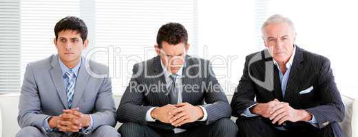 Three charismatic businessmen in a waiting room