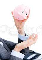 Close-up of a businesswoman holding a piggy-bank