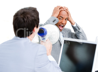 Caucasian businessman yelling through a megaphone