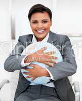 Charismatic businesswoman holding a terrestrial globe