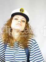 young girl in a captain's cap