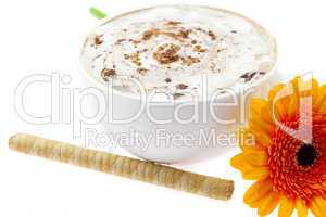 cappuccino wafer rolls and a flower isolated on white