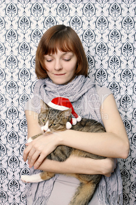 Girl with a Christmas cat