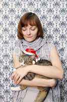 Girl with a Christmas cat
