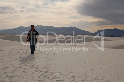 hiker  on dunes left