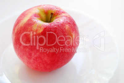 Red apple on a plate