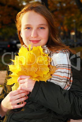 Girl with fall leaves