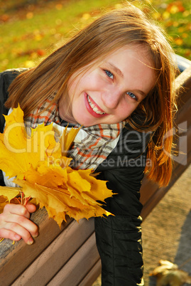 Girl with maple leaves