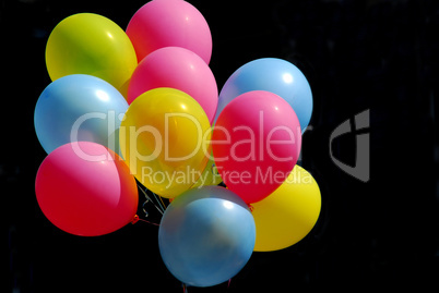 Colorful balloons on black