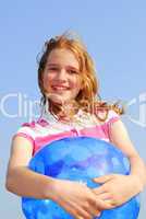 Young girl with beach ball