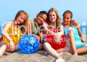 Four girls on a beach