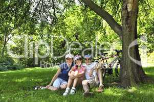 Family resting in a park
