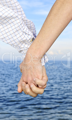 Couple holding hands