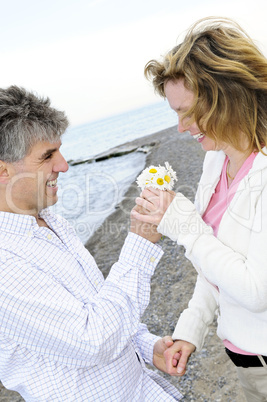 Mature romantic couple with flowers