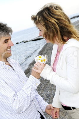 Mature romantic couple with flowers