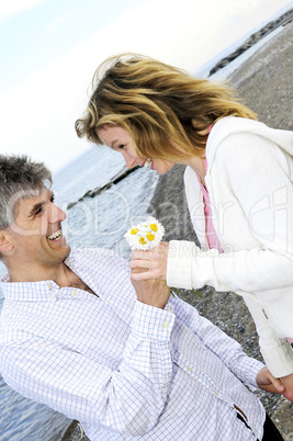 Mature romantic couple with flowers