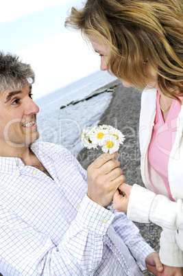 Mature romantic couple with flowers